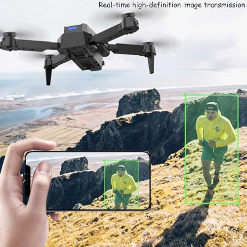Drone capturing real-time high-definition images of a person on a mountainous landscape.